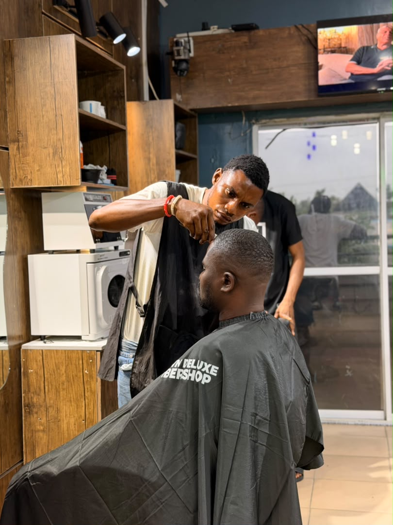 Barber in action at Uptown Deluxe